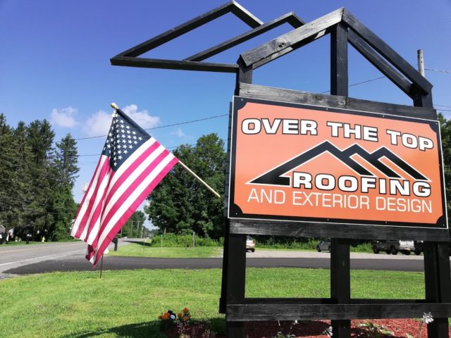 Over The Top Roofing outdoor sign